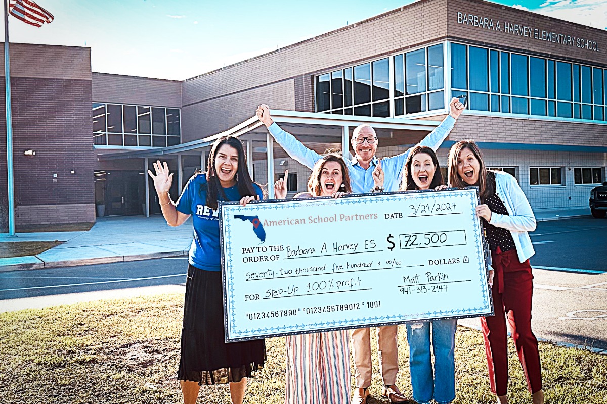 Three Boys & A Dog team celebrating fundraising success with Florida elementary school students